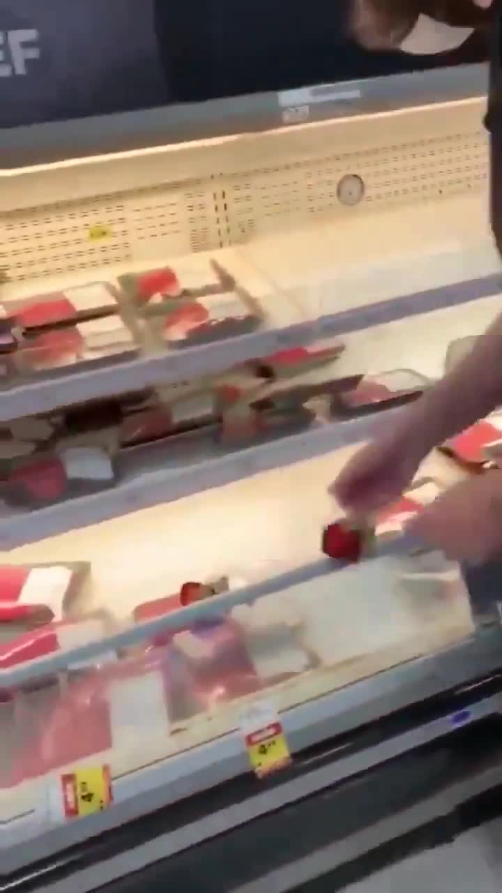 Vegans paying homage to the fallen at the meat counter