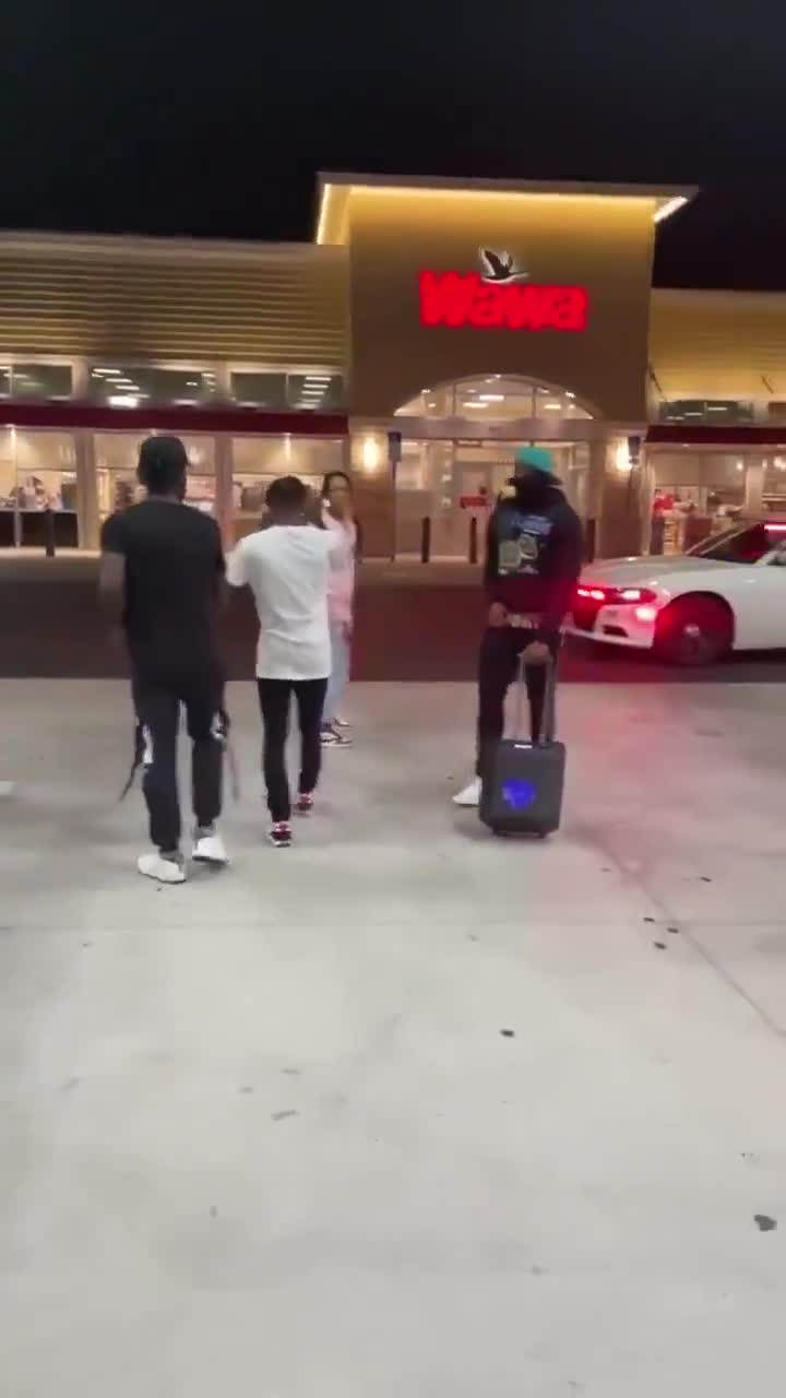 Cop tries to stop teens dancing at gas station