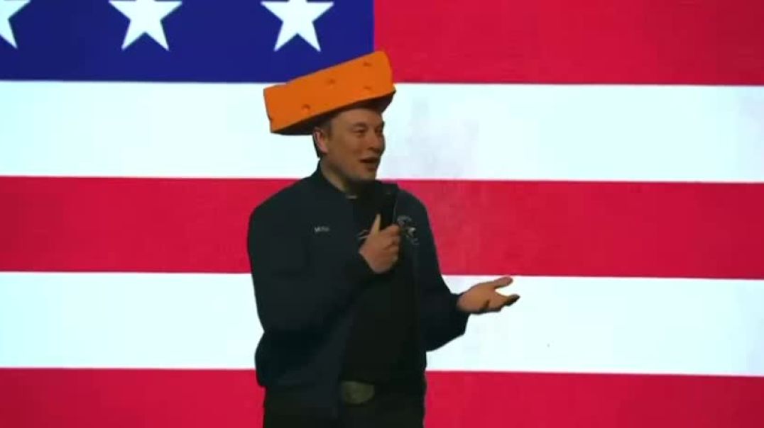 Elon Musk comes out at his rally in Wisconsin wearing a cheese hat! What’s this all about now?