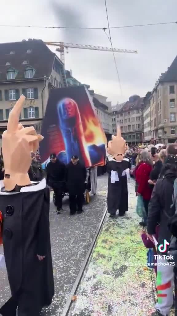 Swiss leftists march in a parade wearing giant middle finger masks to ‘protest’ Trump. Imagine caring this much about a U.S. election you don’t even vote in 🤦‍♂️