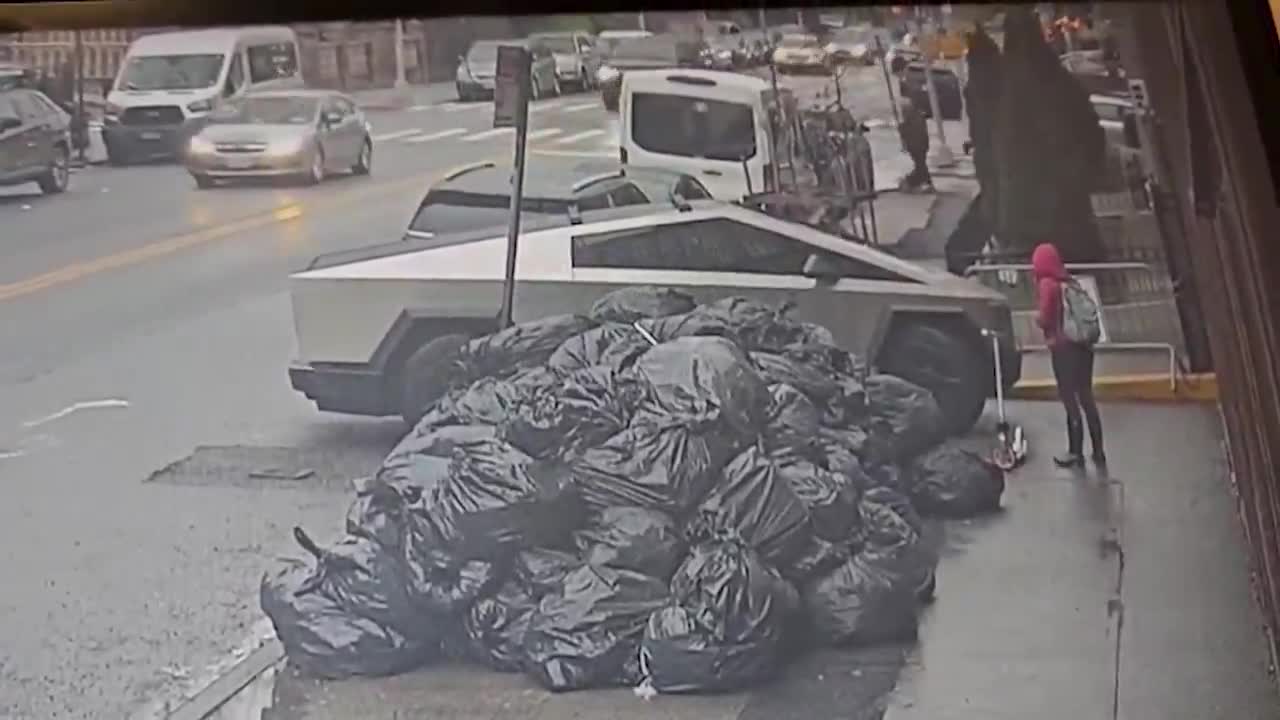 Tesla vandal in Brooklyn caught on camera slamming a brick with the word \