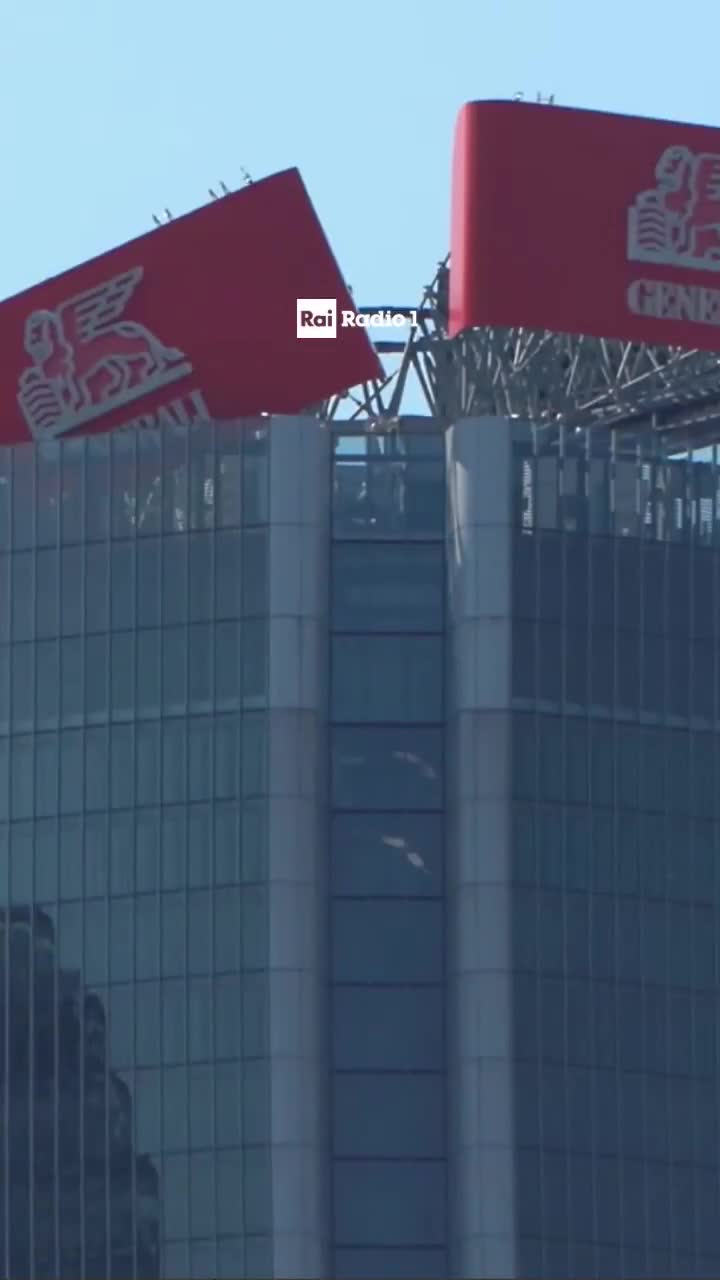 🇮🇹 44 FLOORS UP: GIANT GENERALI SIGN HANGS ON FOR DEAR LIFE  A huge Generali sign on top of one of Milan’s tallest towers collapsed, but it’s still hanging on, barely.  Firefighter...