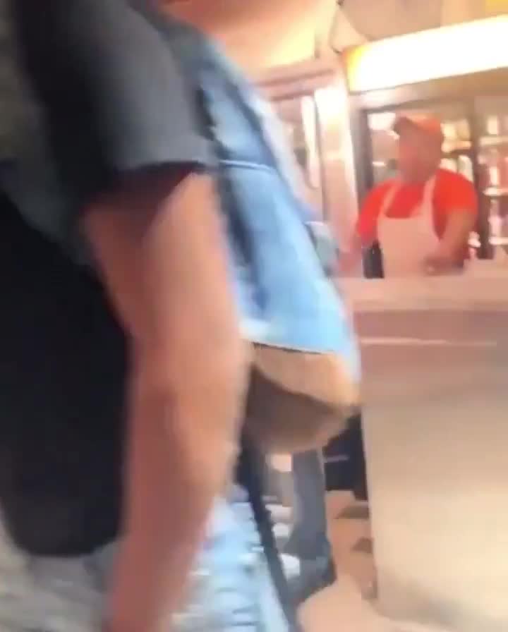 Young man with 1/10 on the strength chart tries to act hard and challenge store employees to a fight