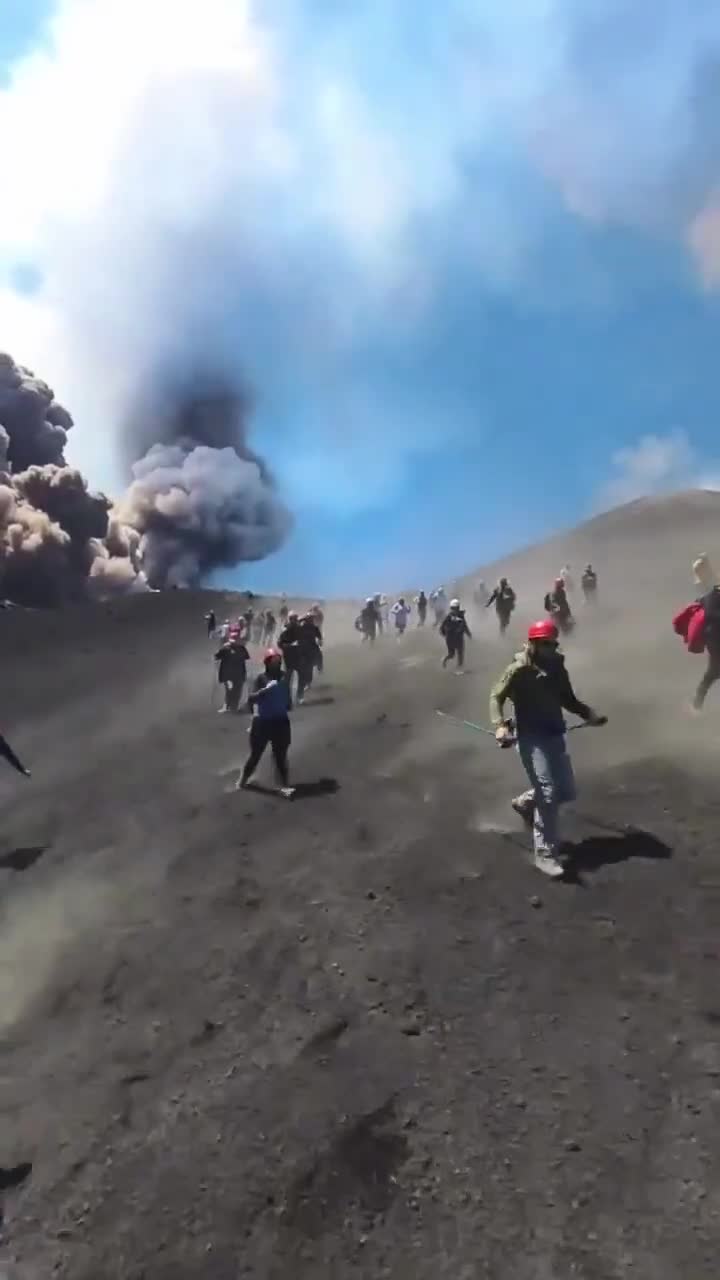 Tourists and guides run for their lives when Mount Etna suddenly erupts