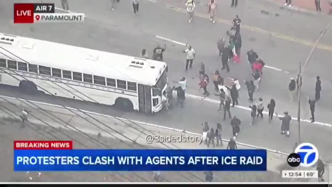 A crowd is now surrounding and attempting to block a U.S. Marshals Service bus demonstrations against ICE  raids in Paramount, California.