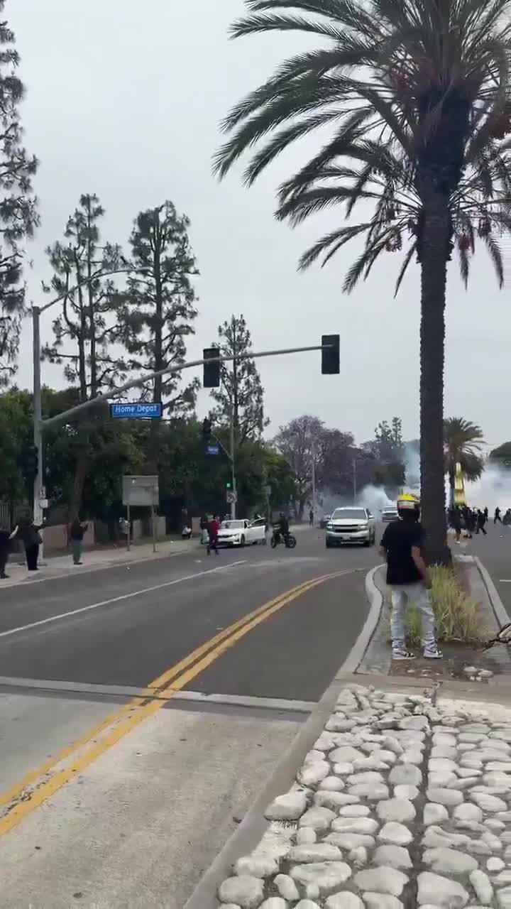 Man throwing rocks at vehicles in Los Angeles during mostly peaceful immigration protests