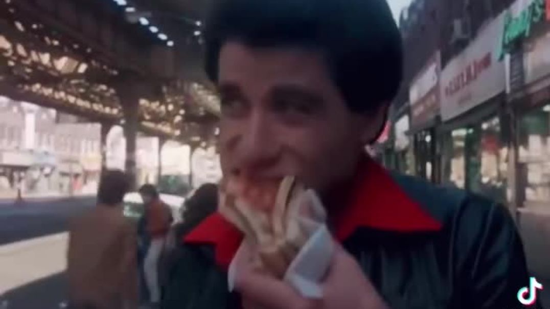 How many of you ever noticed  John Travolta’s  RED SHOES  AND Eating PIZZA  in the opening scene of the movie: “Saturday Night Fever”?