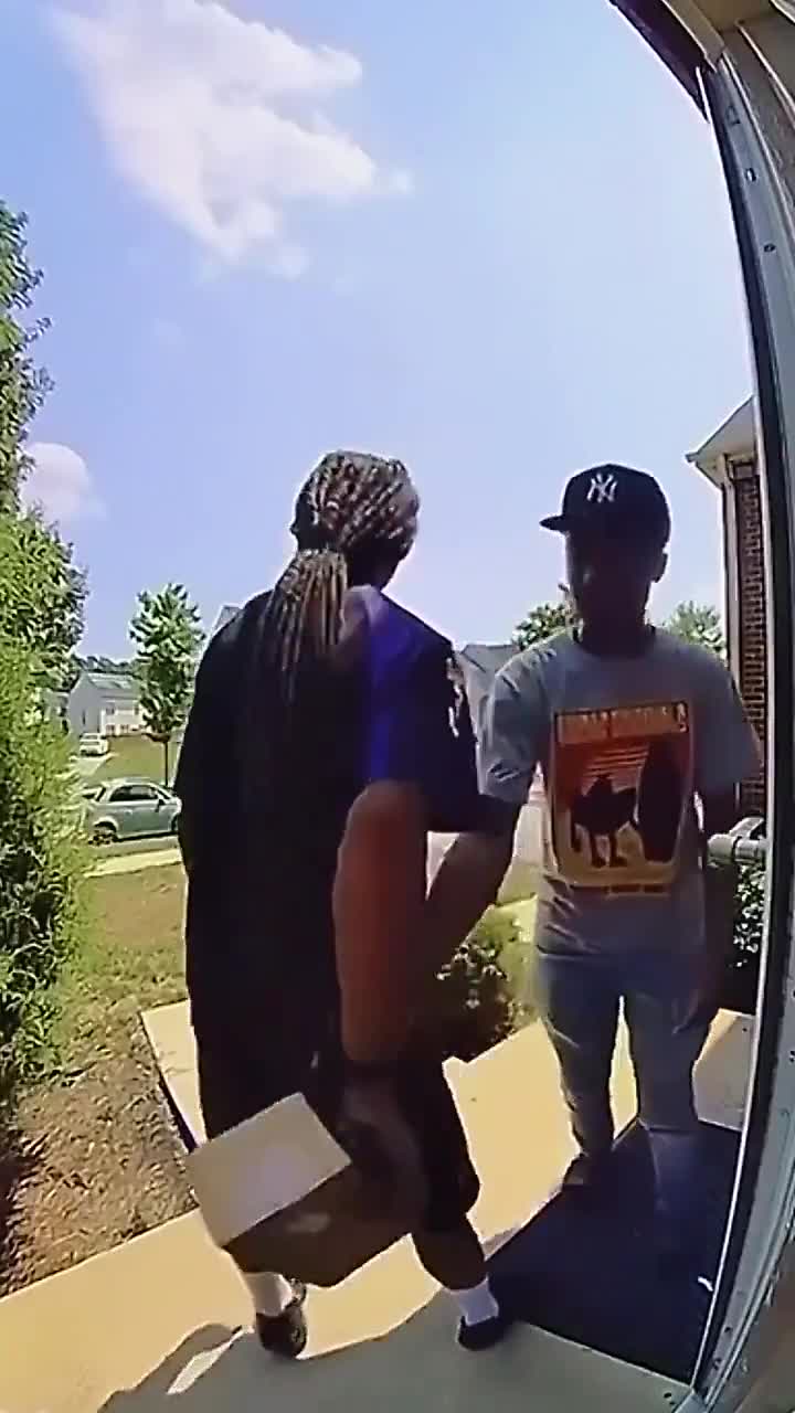 FedEx delivery guy fights off two porch pirates and delivers the package