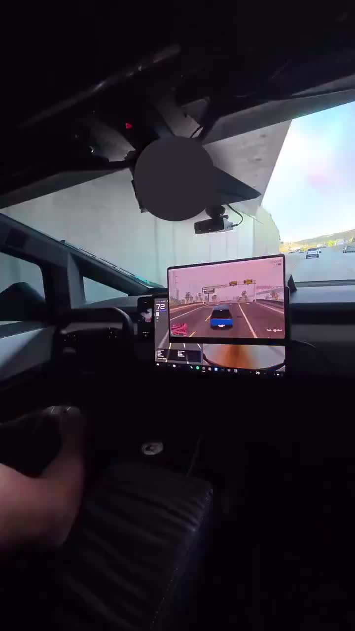Bro playing Car Video Game whilst his Tesla Car drives itself.    The future is already here.