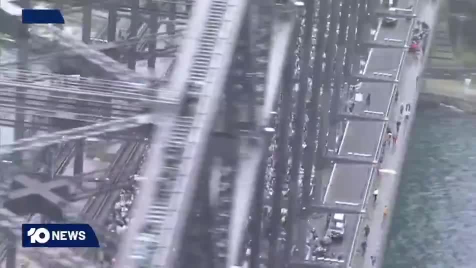 Sydney Harbour Bridge swamped by a tidal wave for humanity in what many believe was the biggest anti-war protest Australia has ever seen  Josh Lees: “The point is to do it with 100,000 peo...