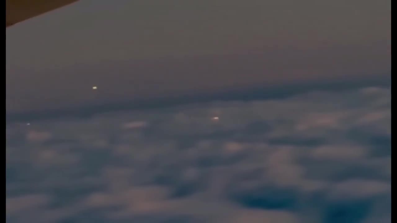 The only unidentified glowing Orbs & Spheres being witnessed everywhere are multiplying in number.   This Plane Passenger just recorded several at 35,000ft above the Clouds.  Wild.