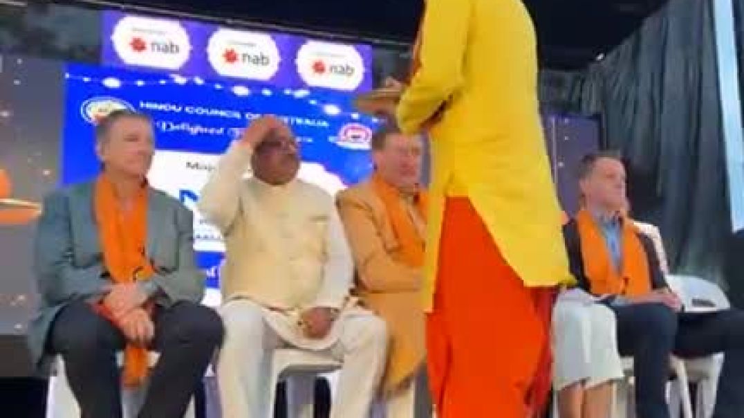 Liberal leader Sussan Ley gets a dot painted on her head at an Indian festival in western Sydney.