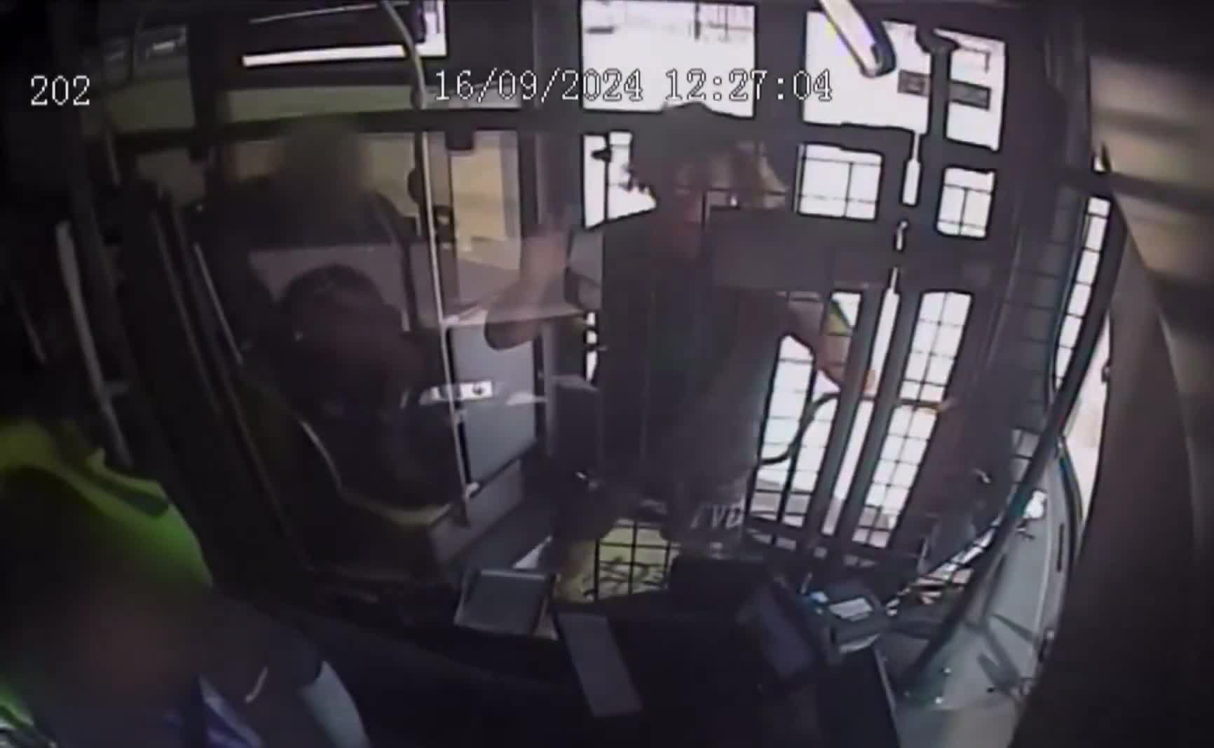 CCTV footage shows a bus driver being assaulted while driving down Darwin highway, yelling “change the f*****g station man”