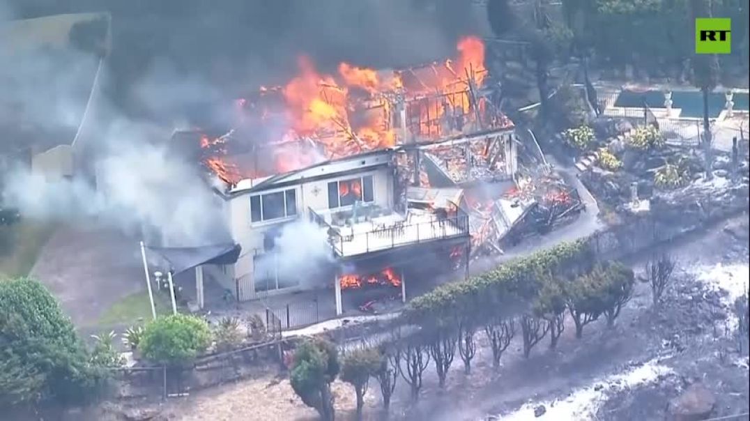 MASSIVE wildfire sweeps through coastal area north of Sydney, Australia, damaging or destroying homes