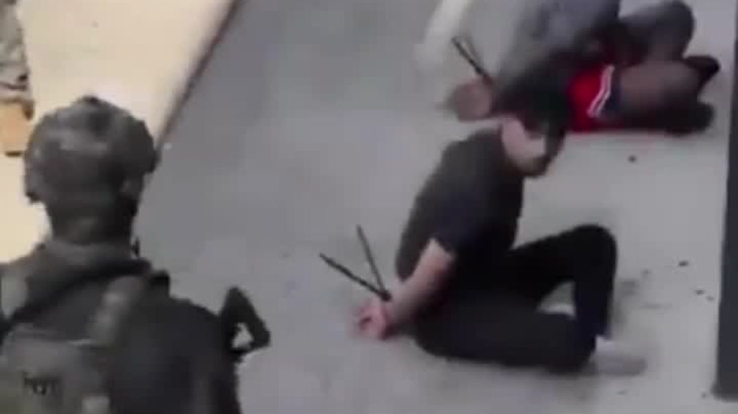 New footage shows NSW Police Public Order and Riot Squad with five men now arrested on the footpath of George Street, Liverpool.