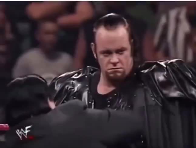 The Undertaker visibly emotional staring at the spot where Owen Hart ...