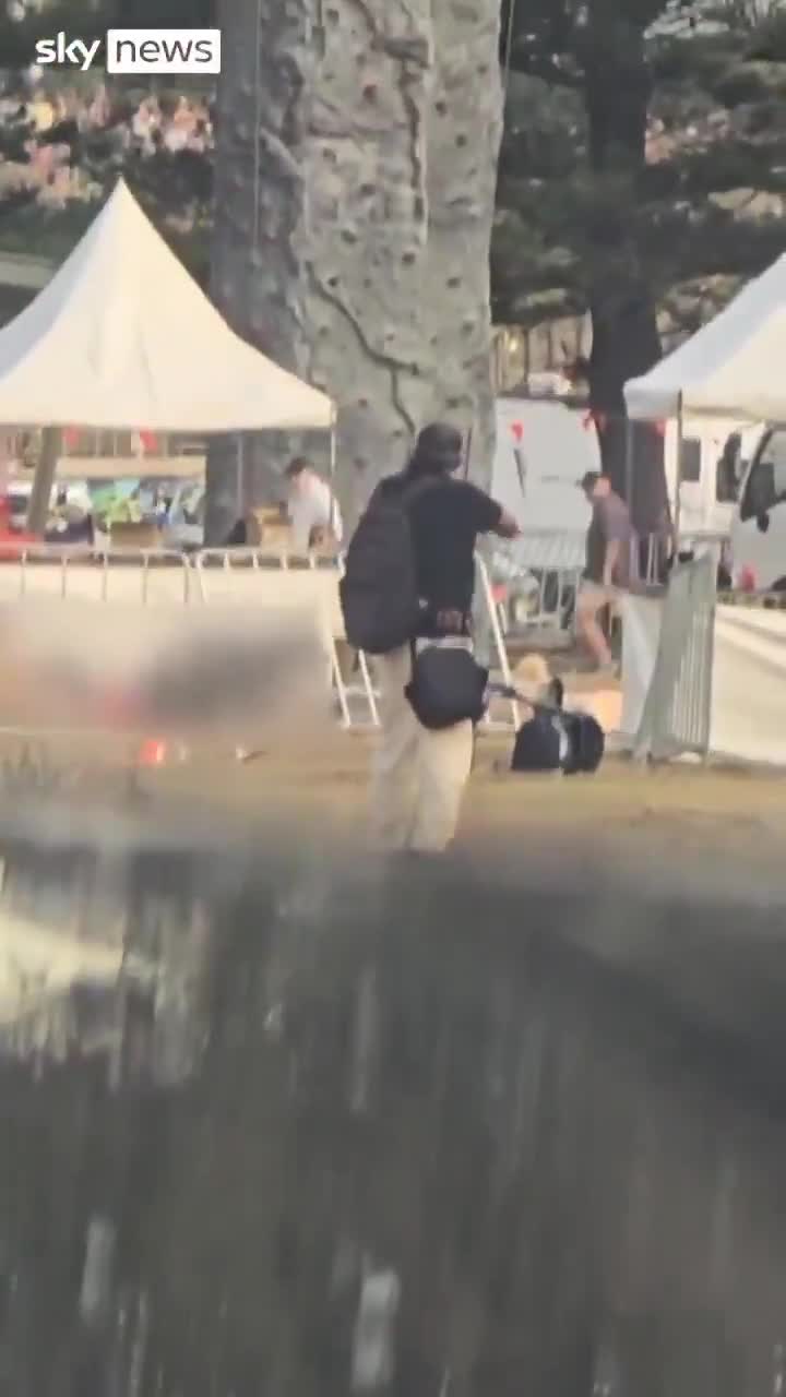 Crazy up close footage of the Bondi Shooter.  Strange how these peopl...