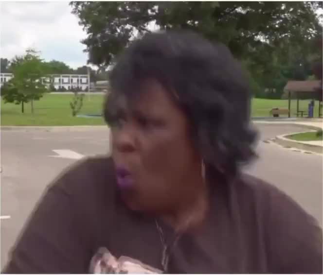 Woman ducks for cover from drive-by shooting during TV interview on c...