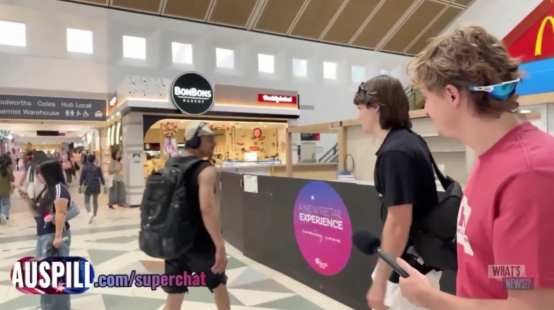 Hugo Lennon, who goes by ‘AUSPILL’ online, confronted by communist ag...