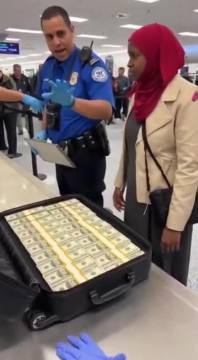 BUSTED at MSP! Somali scammer caught smuggling $800K CASH through TSA in a suitcase—straight from taxpayer-funded scams?   How much more is flying out undetected? Watch this! 🔥