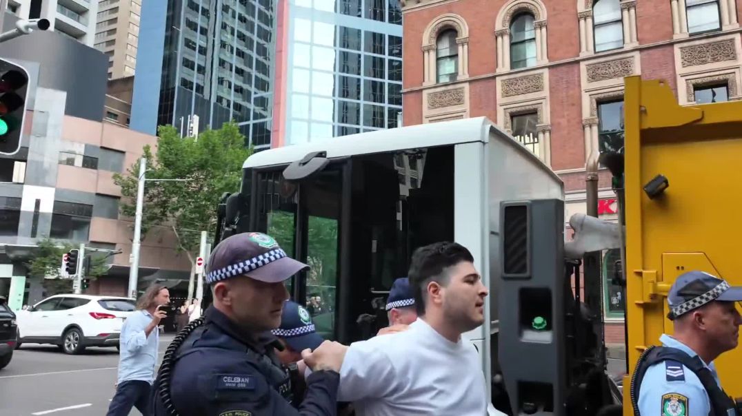 Activist Drew Pavlou has been violently arrested while chanting "USA" at a pro-Venezuela protest at Sydney's Town Hall.