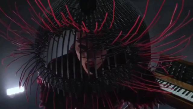 Lady Gaga took the Grammys stage dressed as a caged bird, wrapped in red feathers during her performance.  Her face appeared inside a cage-like structure.  The symbolism is no longer subtle, with clear demonic energy being sacrificed to Satan.